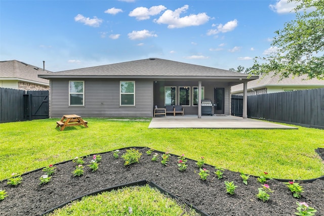2322 Strong Horse Dr, Conroe, TX 77301 - back of house with a patio and a garden