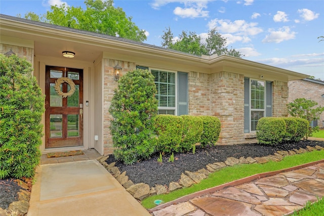 12427 Attlee Dr, Houston, TX 77077 - view of exterior entry featuring brick siding