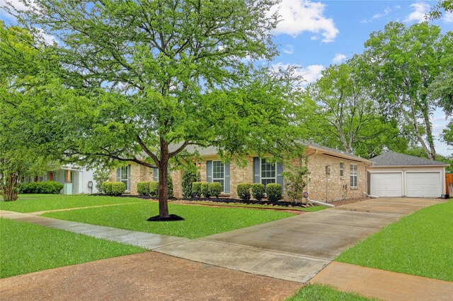 12427 Attlee Dr, Houston, TX 77077 - obstructed view of property with brick siding, a front lawn, and concrete driveway