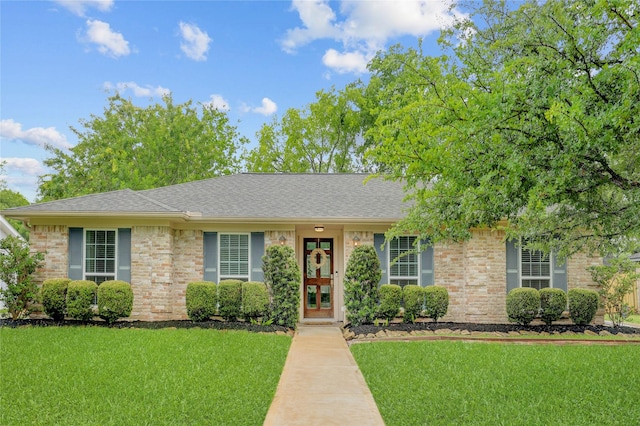 12427 Attlee Dr, Houston, TX 77077 - ranch-style home featuring a front lawn, roof with shingles, brick siding, and french doors