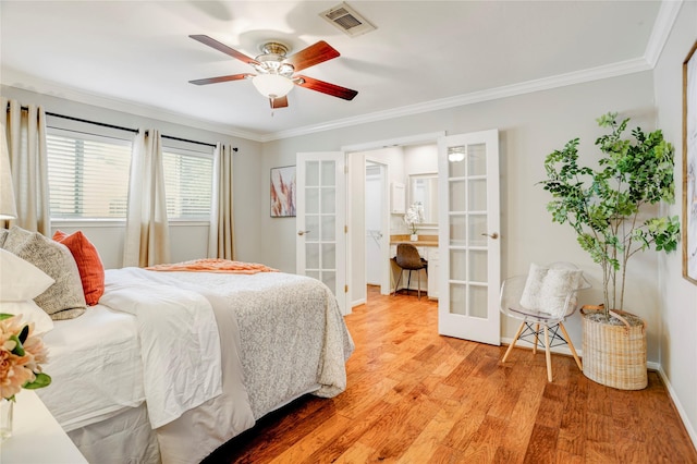 12427 Attlee Dr, Houston, TX 77077 - bedroom with french doors, light wood-type flooring, ornamental molding, baseboards, and a ceiling fan