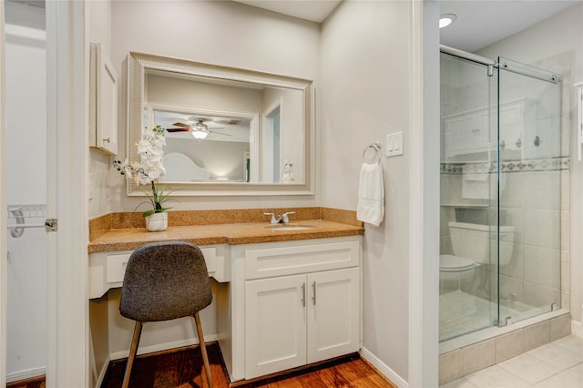 12427 Attlee Dr, Houston, TX 77077 - full bath with a shower stall, vanity, a ceiling fan, and toilet