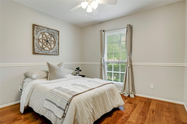 12427 Attlee Dr, Houston, TX 77077 - bedroom with multiple windows, baseboards, and wood finished floors
