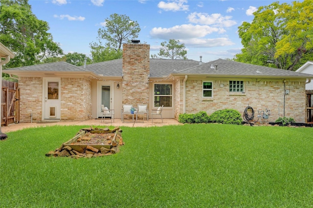 12427 Attlee Dr, Houston, TX 77077 - back of property featuring a shingled roof, a chimney, a patio area, and brick siding