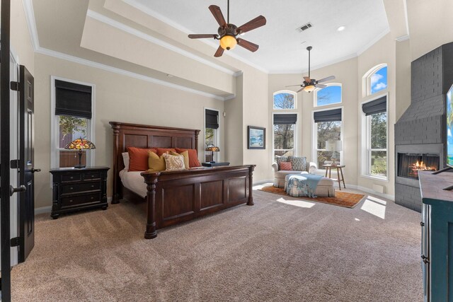 31026 Johlke Rd, Magnolia, TX 77355 - bedroom featuring light carpet, crown molding, a brick fireplace, baseboards, and ceiling fan