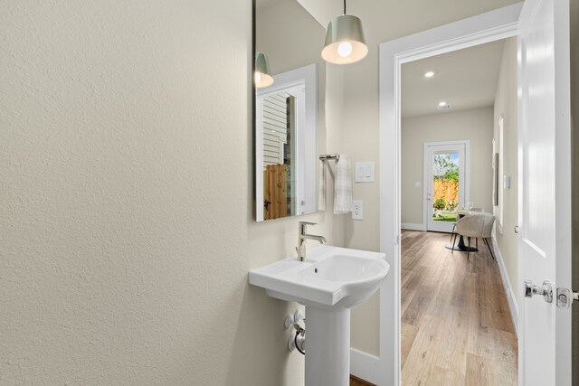 5626 Bertellis Ln, Houston, TX 77091 - bathroom featuring wood finished floors, baseboards, and recessed lighting