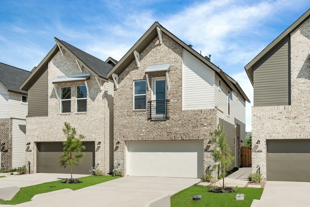 5626 Bertellis Ln, Houston, TX 77091 - view of front facade with a garage, driveway, and brick siding