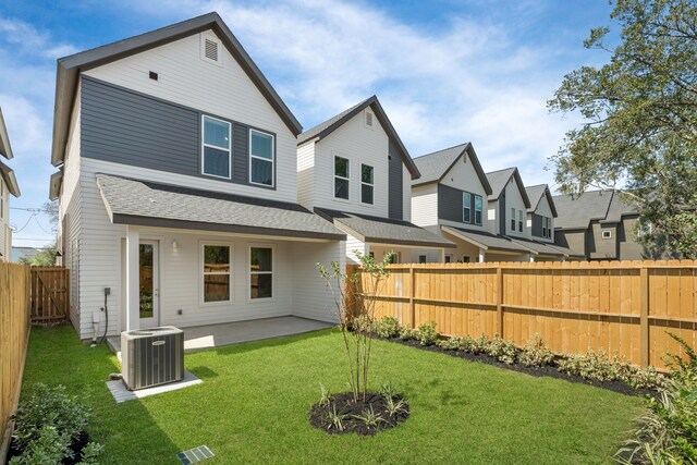 5626 Bertellis Ln, Houston, TX 77091 - rear view of property featuring central AC unit, a patio area, a shingled roof, and a residential view