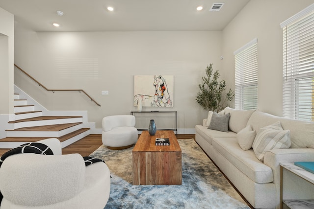 5626 Bertellis Ln, Houston, TX 77091 - living room featuring stairs, wood finished floors, recessed lighting, and baseboards