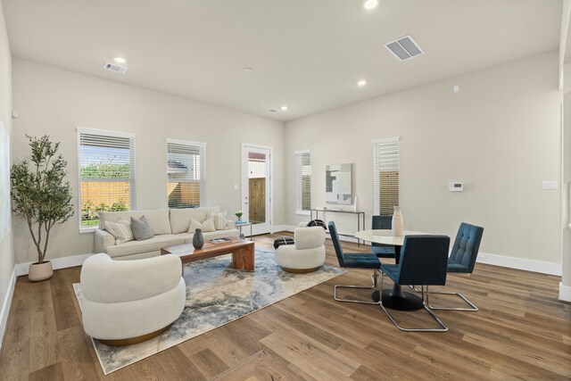 5626 Bertellis Ln, Houston, TX 77091 - living area with baseboards, wood finished floors, and recessed lighting