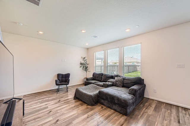 8126 Coco Bluff Dr, Cypress, TX 77433 - living area with wood finished floors, baseboards, and recessed lighting