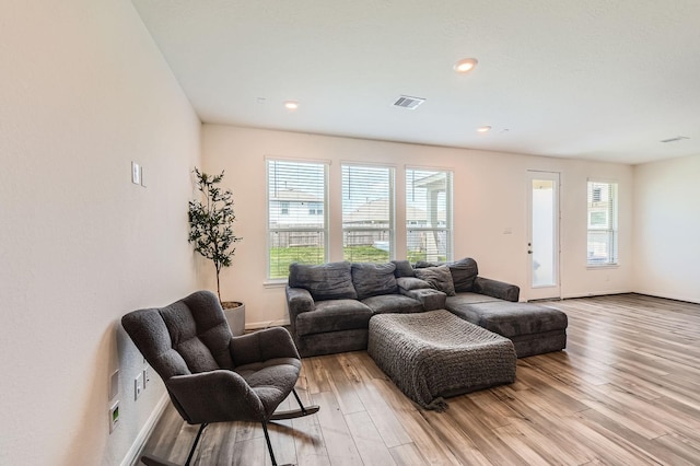 8126 Coco Bluff Dr, Cypress, TX 77433 - living area featuring plenty of natural light, light wood-style floors, baseboards, and recessed lighting