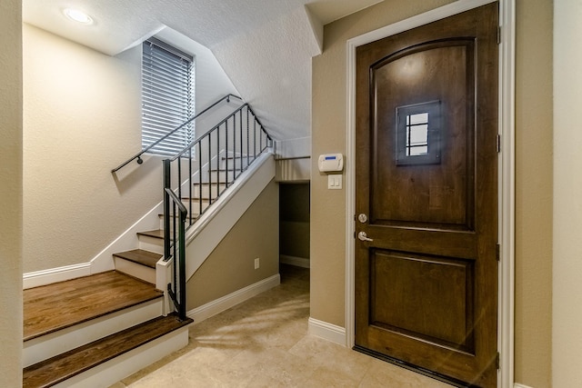 1610 Knox St Unit A, Houston, TX 77007 - entrance foyer featuring baseboards and stairs