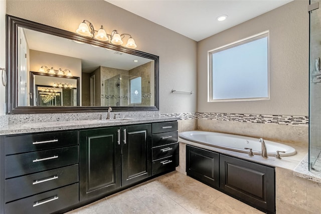 1610 Knox St Unit A, Houston, TX 77007 - full bath featuring a bath, vanity, a stall shower, and tile patterned floors