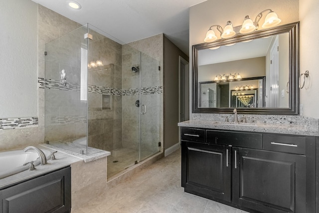 1610 Knox St Unit A, Houston, TX 77007 - bathroom featuring a garden tub, a shower stall, vanity, and tile patterned flooring