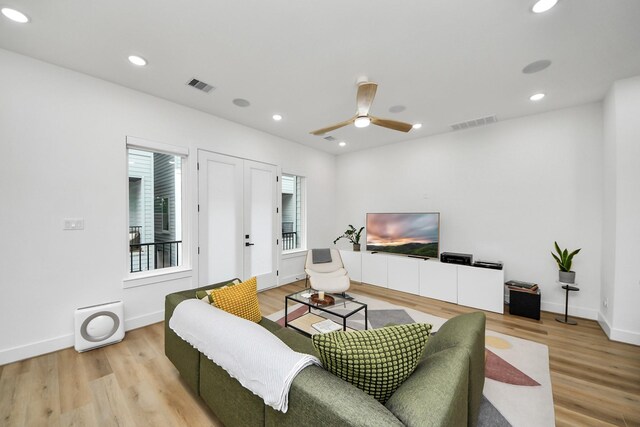3022 Live Oak St, Houston, TX 77004 - living area featuring light wood finished floors, baseboards, ceiling fan, and recessed lighting