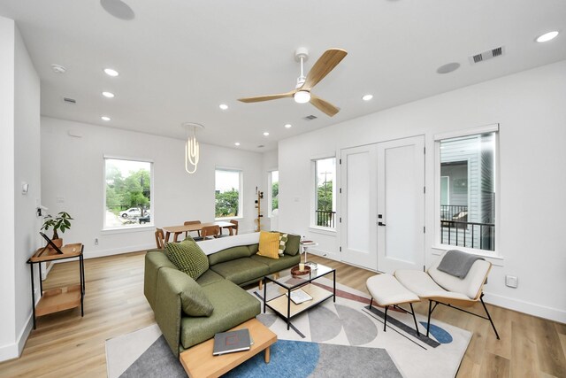 3022 Live Oak St, Houston, TX 77004 - living area with light wood-style flooring, baseboards, and recessed lighting