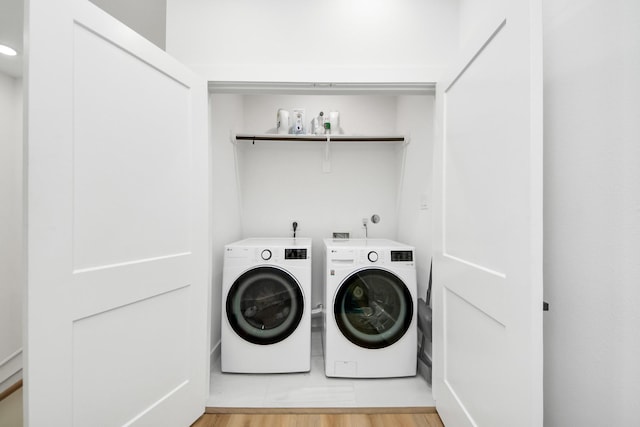 3022 Live Oak St, Houston, TX 77004 - laundry room featuring independent washer and dryer and light wood-type flooring
