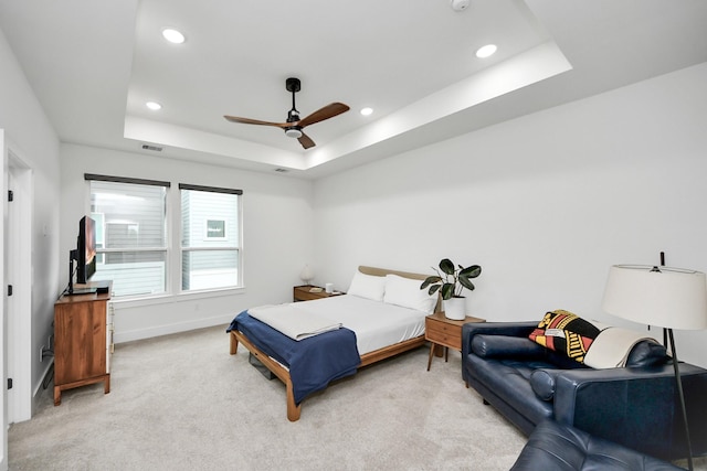 3022 Live Oak St, Houston, TX 77004 - bedroom with light carpet, a tray ceiling, recessed lighting, baseboards, and a ceiling fan