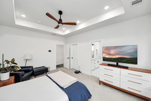 3022 Live Oak St, Houston, TX 77004 - bedroom featuring a tray ceiling, light carpet, recessed lighting, baseboards, and ceiling fan