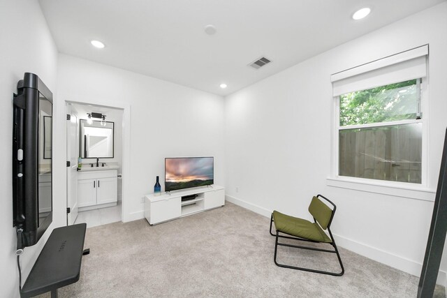 3022 Live Oak St, Houston, TX 77004 - living area featuring light carpet, baseboards, and recessed lighting