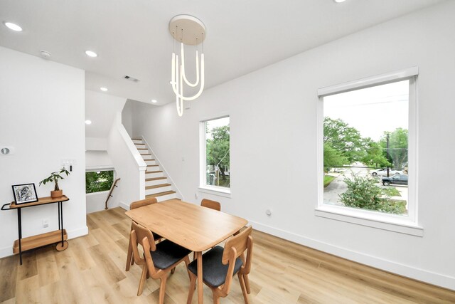 3022 Live Oak St, Houston, TX 77004 - dining space with plenty of natural light, light wood-type flooring, recessed lighting, stairs, and baseboards