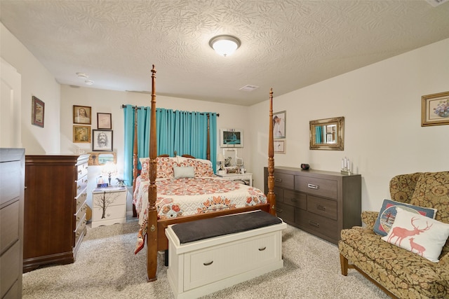 999 Arbor Gln, Conroe, TX 77303 - bedroom featuring light carpet and a textured ceiling