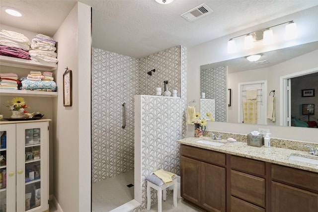 999 Arbor Gln, Conroe, TX 77303 - bathroom with a walk in shower and double vanity