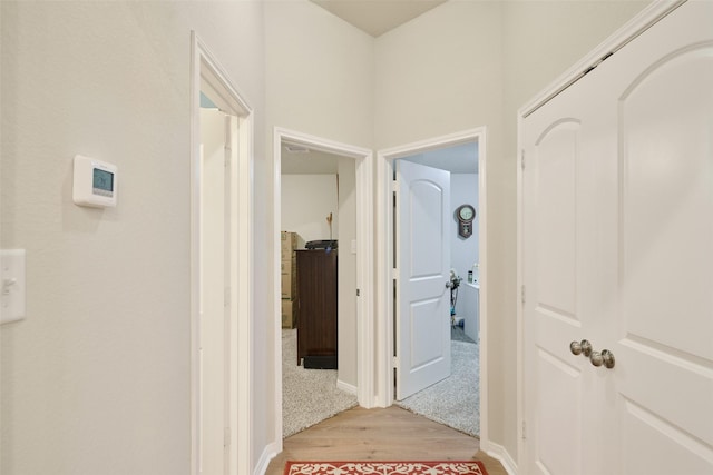 999 Arbor Gln, Conroe, TX 77303 - corridor with light wood-style floors and baseboards