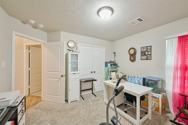 999 Arbor Gln, Conroe, TX 77303 - home office featuring a textured ceiling and light carpet