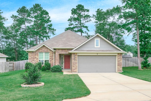 999 Arbor Gln, Conroe, TX 77303 - view of front of property featuring an attached garage, driveway, and brick siding