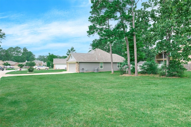 999 Arbor Gln, Conroe, TX 77303 - view of property exterior with driveway, a lawn, and a garage