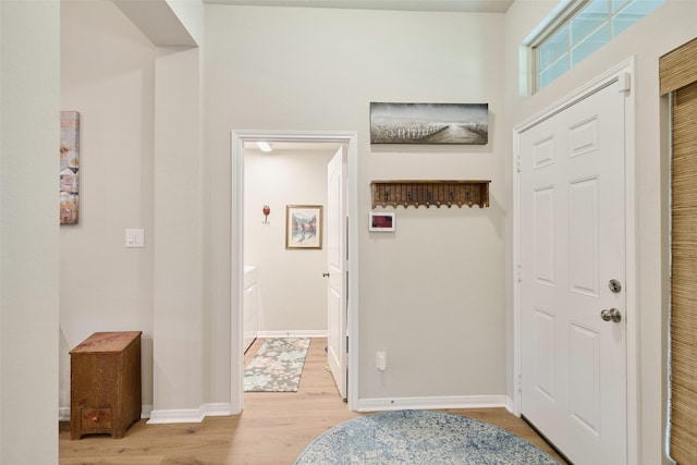 999 Arbor Gln, Conroe, TX 77303 - foyer featuring light wood finished floors and baseboards