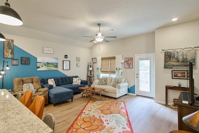 999 Arbor Gln, Conroe, TX 77303 - living area featuring light wood finished floors, ceiling fan, vaulted ceiling, recessed lighting, and baseboards