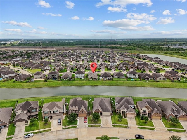 726 Rim Water Dr, Alvin, TX 77511 - aerial view of residential area featuring a nearby body of water