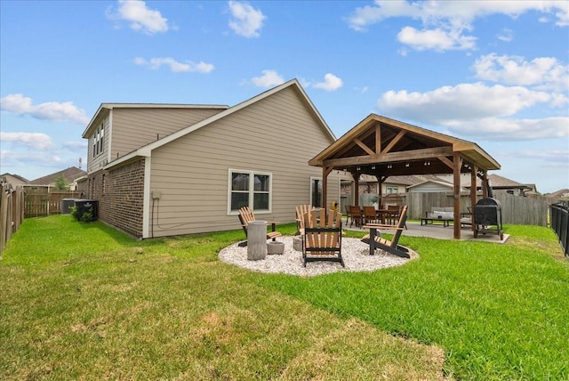 726 Rim Water Dr, Alvin, TX 77511 - back of house featuring a gazebo, a patio, brick siding, and an outdoor living space