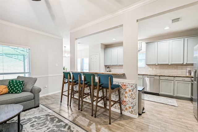 3602 Pine Stream Dr, Pearland, TX 77581 - kitchen featuring dishwasher, plenty of natural light, tasteful backsplash, light wood-style floors, and ornamental molding