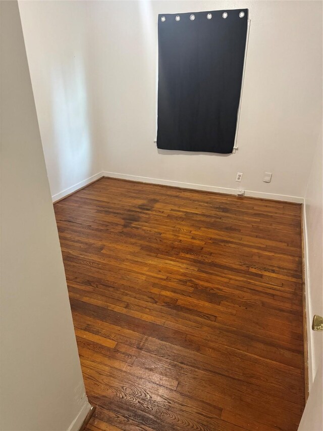 5045 Raleigh Dr, Beaumont, TX 77706 - unfurnished room featuring dark wood-style floors and baseboards
