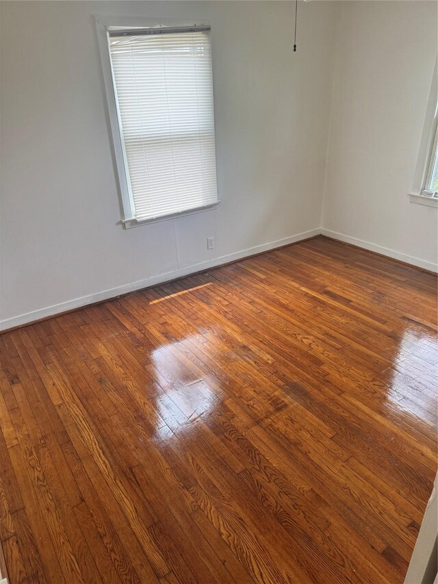 5045 Raleigh Dr, Beaumont, TX 77706 - spare room with hardwood / wood-style flooring and baseboards