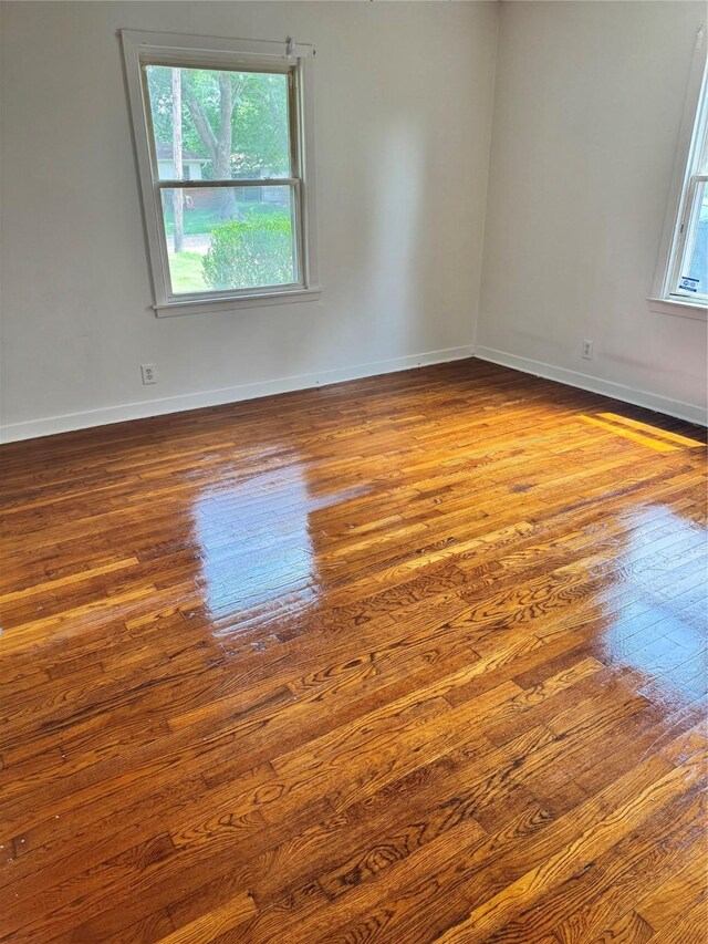 5045 Raleigh Dr, Beaumont, TX 77706 - spare room featuring dark wood-type flooring and baseboards