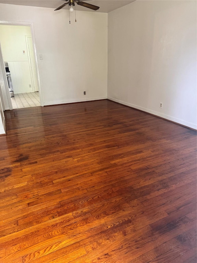 5045 Raleigh Dr, Beaumont, TX 77706 - empty room with ceiling fan, dark wood-style flooring, and baseboards