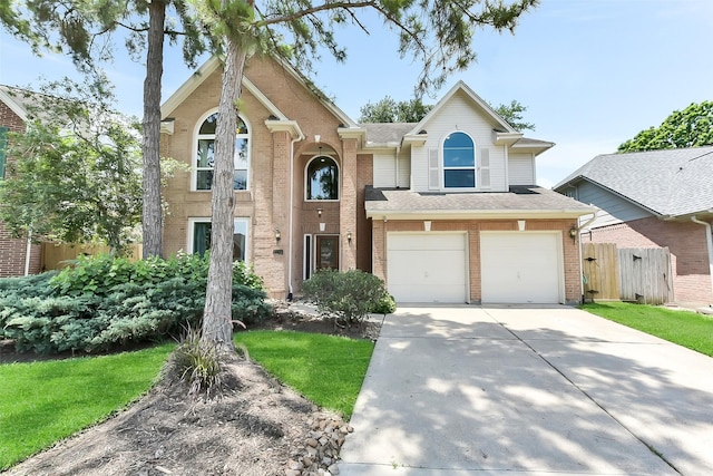 7711 Silent Star Ct, Houston, TX 77095 - traditional-style house with driveway, a garage, brick siding, and roof with shingles