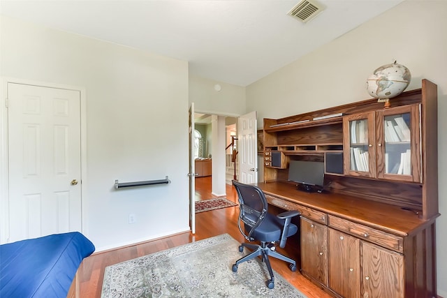 7711 Silent Star Ct, Houston, TX 77095 - office area with light wood-type flooring and built in desk