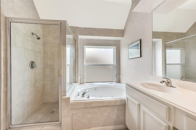 7711 Silent Star Ct, Houston, TX 77095 - bathroom featuring a shower stall, a tub with jets, and vanity