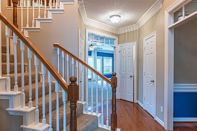 13219 Allysum Ct, Cypress, TX 77429 - entryway with ornamental molding, wood-type flooring, ceiling fan, baseboards, and stairway