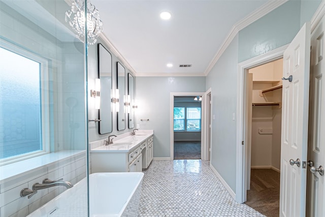 13219 Allysum Ct, Cypress, TX 77429 - bathroom with double vanity, ornamental molding, baseboards, a walk in closet, and recessed lighting