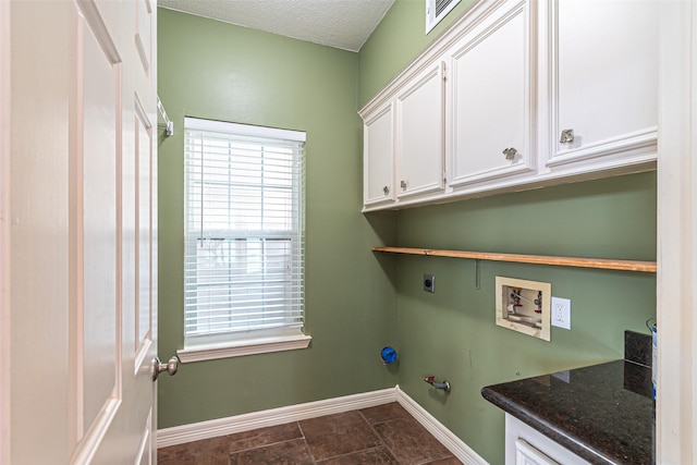 13219 Allysum Ct, Cypress, TX 77429 - laundry room featuring electric dryer hookup, baseboards, cabinet space, hookup for a gas dryer, and washer hookup