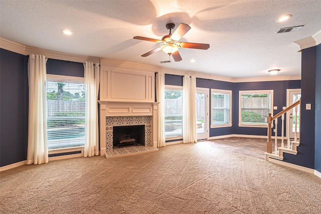 13219 Allysum Ct, Cypress, TX 77429 - unfurnished living room with carpet floors, baseboards, a fireplace, ceiling fan, and a textured ceiling