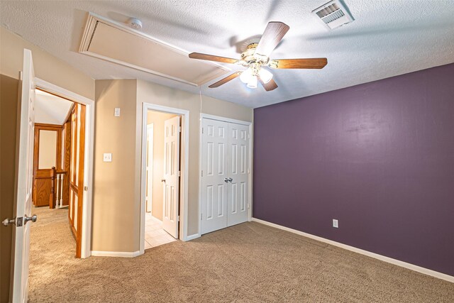 13219 Allysum Ct, Cypress, TX 77429 - unfurnished bedroom with attic access, carpet floors, baseboards, a textured ceiling, and a ceiling fan