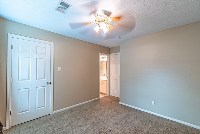 13219 Allysum Ct, Cypress, TX 77429 - unfurnished bedroom with carpet floors, baseboards, ceiling fan, and connected bathroom
